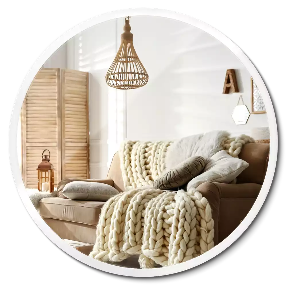 Espelho circular pendurado em moldura branca