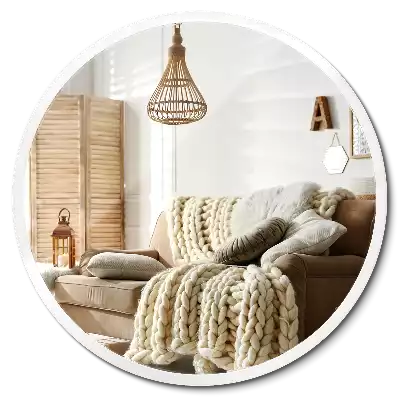 Espelho circular pendurado em moldura branca